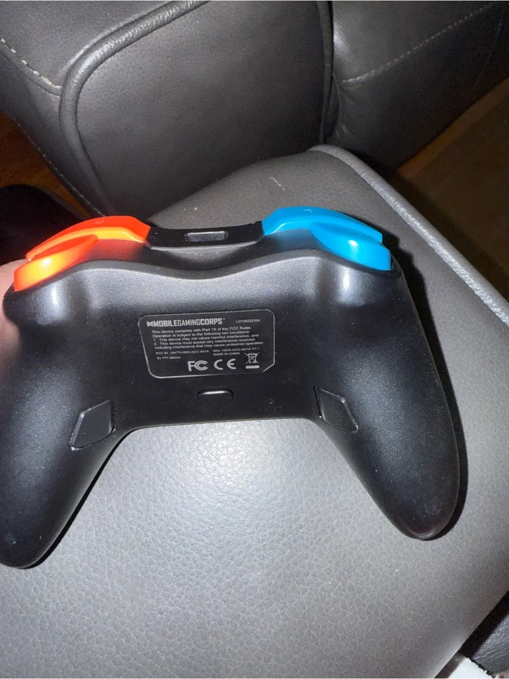 Brand new Black Wireless Game Controller with Blue & Orange Accents